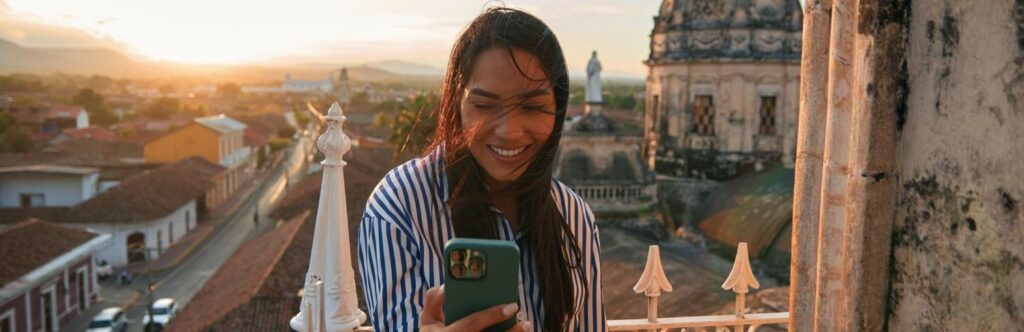 girl on balcony taking a selfie in brazil